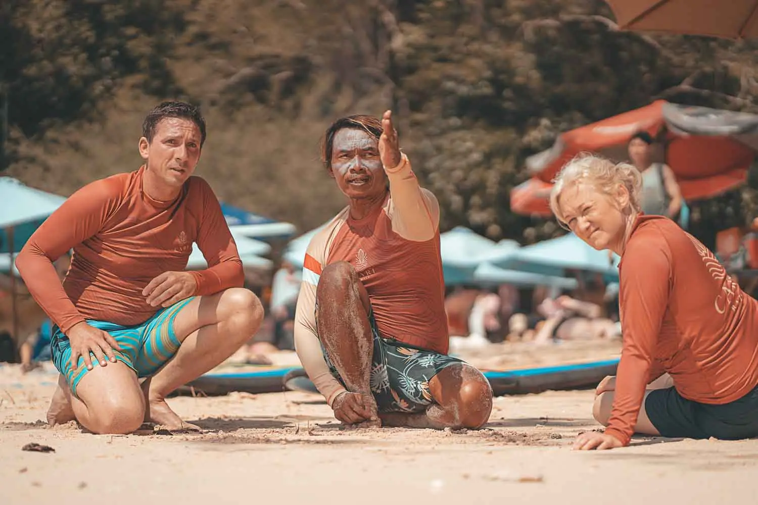 Two Cari Surf Students getting a Spot introduction from a Surf Teacher. before a surf lesson at Padang Padang Beach in Bali.