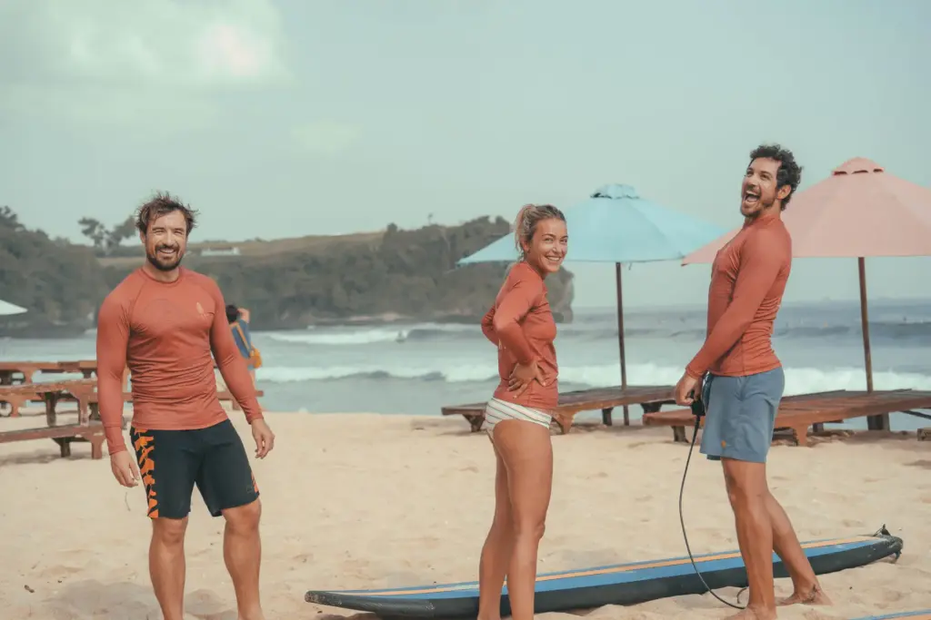 CARI Surf Camp guests with surfboards on the beach