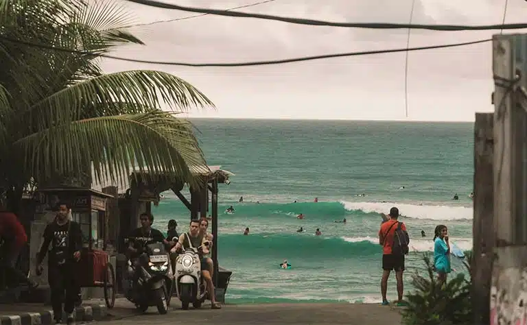 Surfer riding a wave at a Uluwatu surf spot in Bali